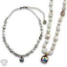 Pink Panache Brands necklace featuring white quartz, freshwater pearls, and Austrian crystals in an elegant jewelry design.