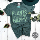 The Graphic Tee Plants Make Me Happy short sleeve graphic T-shirt with a colorful plant design on white fabric.