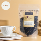 Plum Deluxe Earl Grey Black Tea with Creme Brulee flavor in an 8-ounce package, showing the tea leaves and packaging.