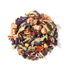 Plum Deluxe Butterfly Herbal Tea with butterfly pea flowers and berries, vibrant dried herbal tea blend in a jar.