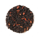 Plum Deluxe Porch Sippin' Pecan Black Tea in a clear glass cup showing dark brewed tea with pecan pieces.