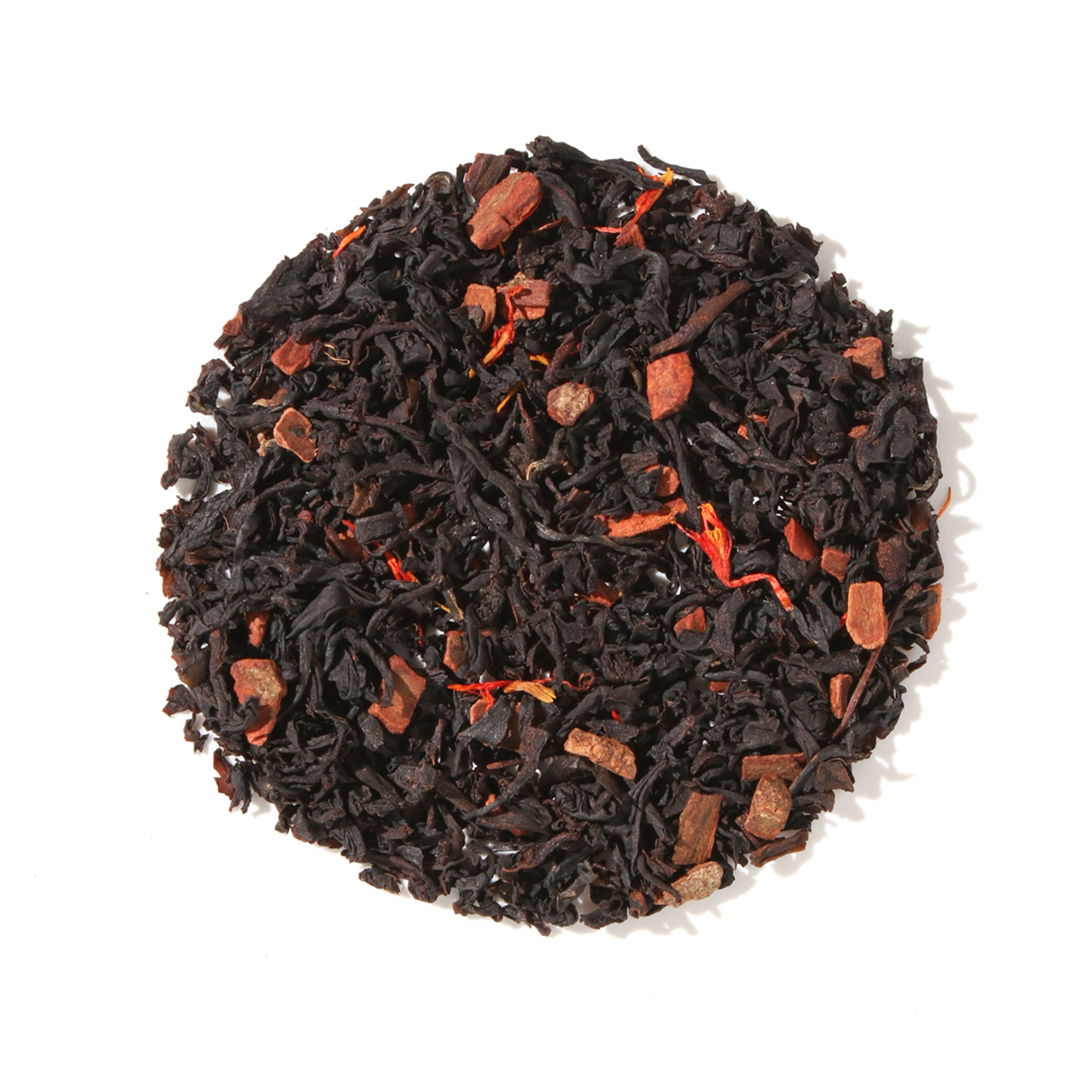 Plum Deluxe Porch Sippin' Pecan Black Tea in a clear glass cup showing dark brewed tea with pecan pieces.