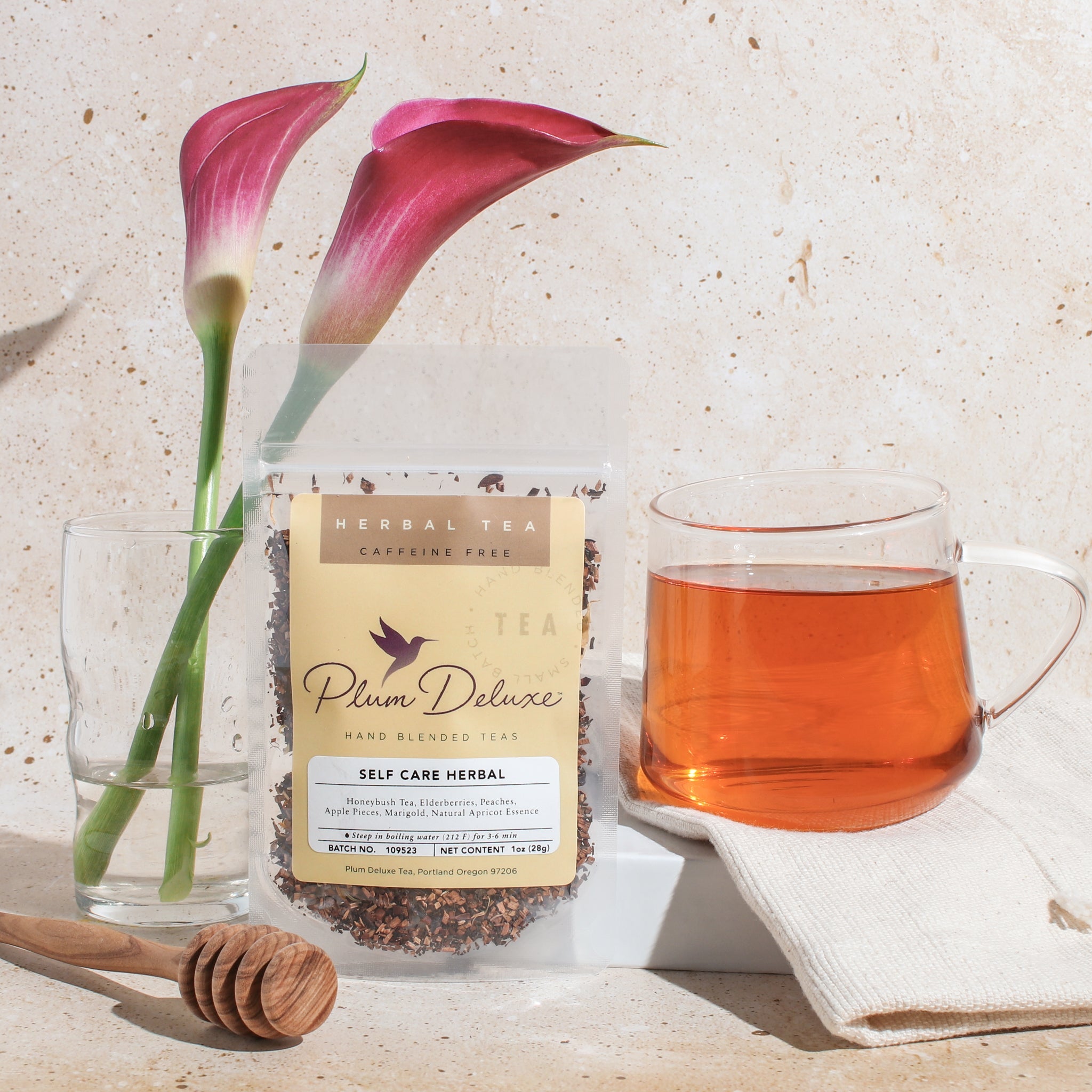 A 1 oz package of Plum Deluxe Tea's Self Care Blend with elderberry and apricot flavors in a clear bag.