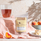 Tranquil Peach Herbal Tea by Plum Deluxe, 1 oz bag with pineapple, peach, and chamomile herbs, ideal for soothing tea blends.