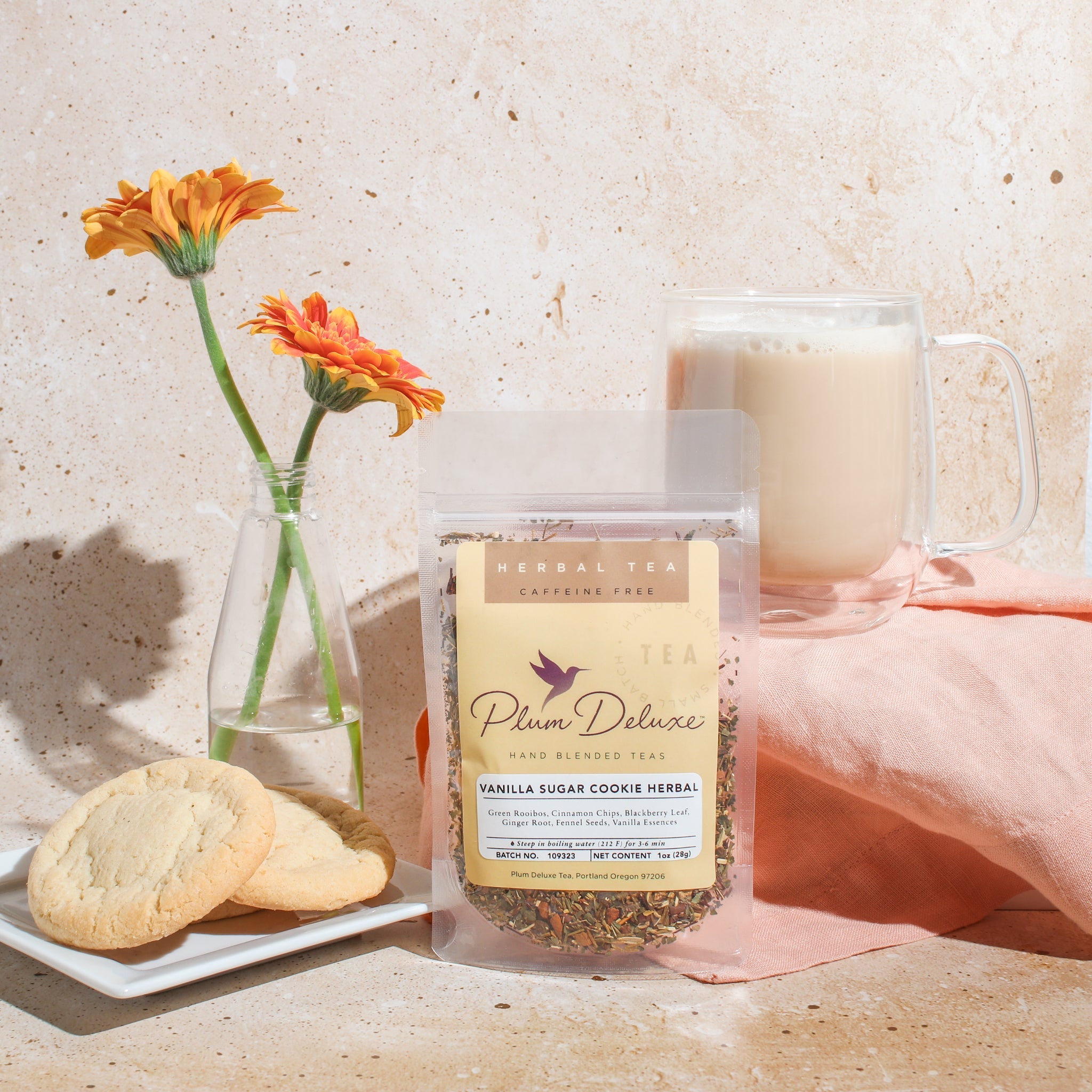 Herbal dessert tea by Plum Deluxe featuring vanilla and sugar cookie flavor in a 1 oz package, close-up of the tea blend.