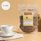 Plum Deluxe Vanilla Sugar Cookie Herbal Dessert Tea in a 1 oz package, featuring a cozy vanilla and sweet cookie aroma.