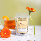 Plum Deluxe Peach 'n' Cream Oolong Tea with peach and vanilla flavor, shown in a 1oz package.
