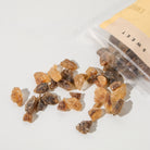 Plum Deluxe Tea Deluxe Tea Sugar rock sugar for tea in a clear jar, showing large crystalline sugar pieces for sweetening tea.
