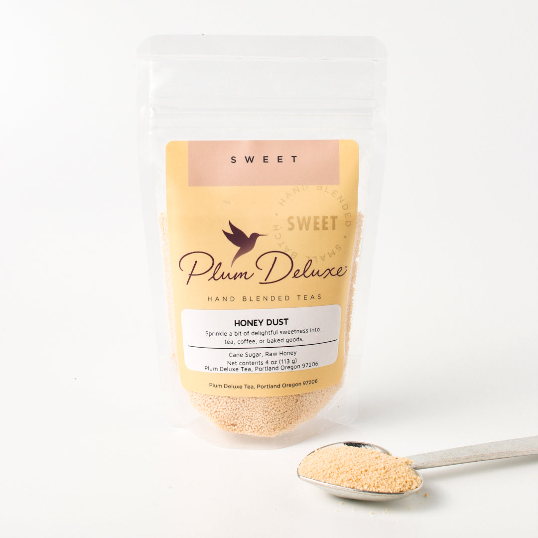 Plum Deluxe Honey Dust with cane sugar and raw honey, fine granular texture in a 4 oz container.