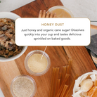 Plum Deluxe Honey Dust with cane sugar and raw honey in a 4 oz container, showing the textured golden powder.