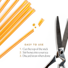 Amber carrot blossom honey sticks for tea by Plum Deluxe Tea, showcasing natural honey sticks in a clear wrapper.
