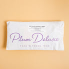 Assorted Plum Deluxe Tea best sellers sampler set with various caffeinated tea flavors in colorful packaging.