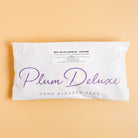 Assorted Plum Deluxe Tea Best Sellers Sampler Set featuring various caffeinated tea blends in colorful packaging.