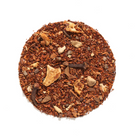 Cup of Autumn Almond Chai Herbal tea from Plum Deluxe Tea, featuring a warm, spiced herbal tea with almond flavor in a clear glass mug.