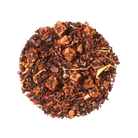 Banana Bread Herbal Dessert Tea with Chocolate and Chestnut by Plum Deluxe Tea, steaming in a teacup with tea leaves.