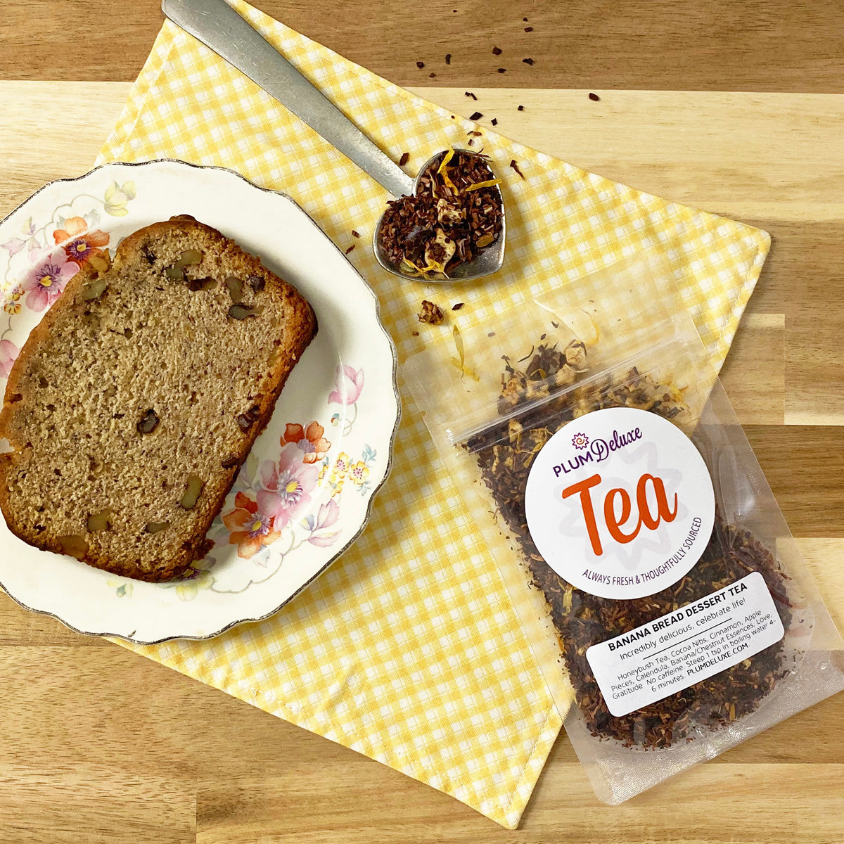 Cup of Plum Deluxe Banana Bread Herbal Dessert Tea with chocolate and chestnut flavors in a clear glass mug.