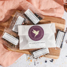 Big Flavor Refresh Sampler Kit by Plum Deluxe Tea featuring a variety of colorful tea blends in a box.