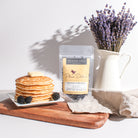 Breakfast in Bed Black Tea by Plum Deluxe, featuring blackberry and hazelnut flavor in a brewed black tea cup.