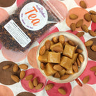 Cup of Caramel Almond Black Tea by Plum Deluxe Tea, showcasing the brewed tea in a clear glass cup with a caramel almond flavor.