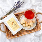 Plum Deluxe Tea Classic Shortbread Bites on a plate, showcasing golden, buttery, bite-sized shortbread cookies.