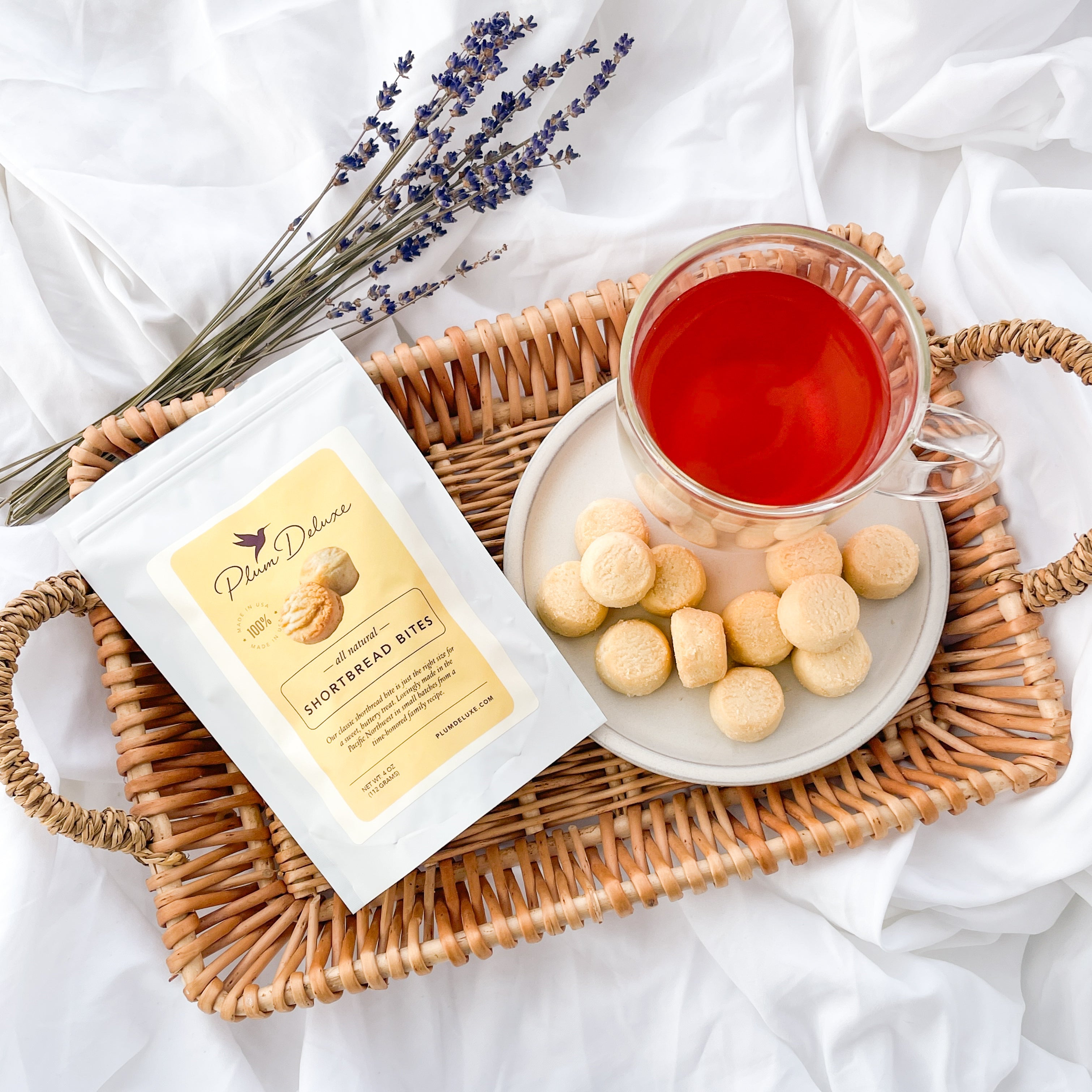 Plum Deluxe Tea Classic Shortbread Bites on a plate, showcasing golden, buttery, bite-sized shortbread cookies.