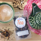Decaf No Obligations Black Tea by Plum Deluxe with hazelnut, almond, and cinnamon flavors in a tea bag or loose leaf.