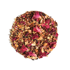 Herbal tea blend in a teacup with elderflower, lemon, and rose, from Plum Deluxe Tea's Evening in the Garden collection.