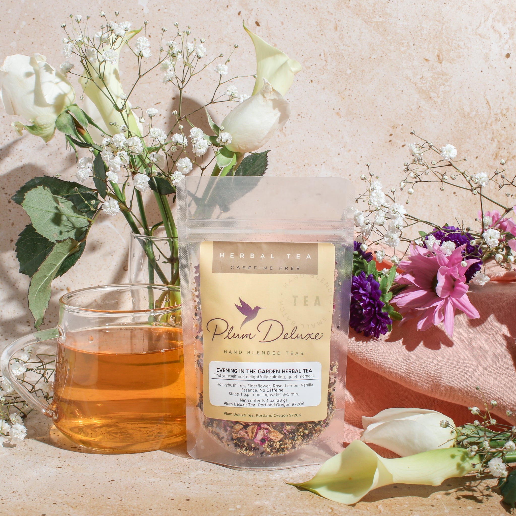 Herbal tea blend in a cup with elderflower, lemon, and rose from Plum Deluxe Tea's Evening in the Garden collection.
