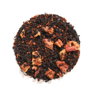 Black tea from Plum Deluxe, Halloween Blend with vanilla and caramel flavors, in a steaming cup with autumn-themed background.