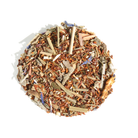 Healthy, Wealthy, & Wise herbal tea by Plum Deluxe, featuring bergamot, sage, lemongrass, and mint in a tea cup.