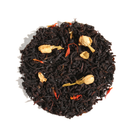 Black tea with vanilla creme brulee aroma from Plum Deluxe Housewarming Blend, showcasing a steaming cup with tea leaves.