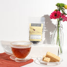Black tea with vanilla crème brûlée flavor from Plum Deluxe Tea's Housewarming Blend, fresh and aromatic in a tea bag.