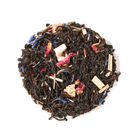 Kitchen Table Blend black and green tea by Plum Deluxe with a secret citrus mix, displayed in a teacup with citrus slices.