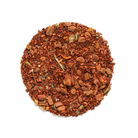 Cup of Pears and Cinnamon Herbal Tea by Plum Deluxe, showcasing a steaming herbal tea with pear and cinnamon flavors in a clear glass mug.