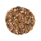 Cup of Plum Deluxe Sugar Plum tea featuring a blend of plum, strawberry, and cardamom in a teacup