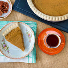 Black tea with roasted strawberry brulee flavor from Plum Deluxe, featuring a rich blend of dried strawberries and tea leaves.