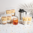Plum Deluxe Tea Ultimate Iced Tea Bundle with tea, pitcher, and lemonade for refreshing cold beverages.