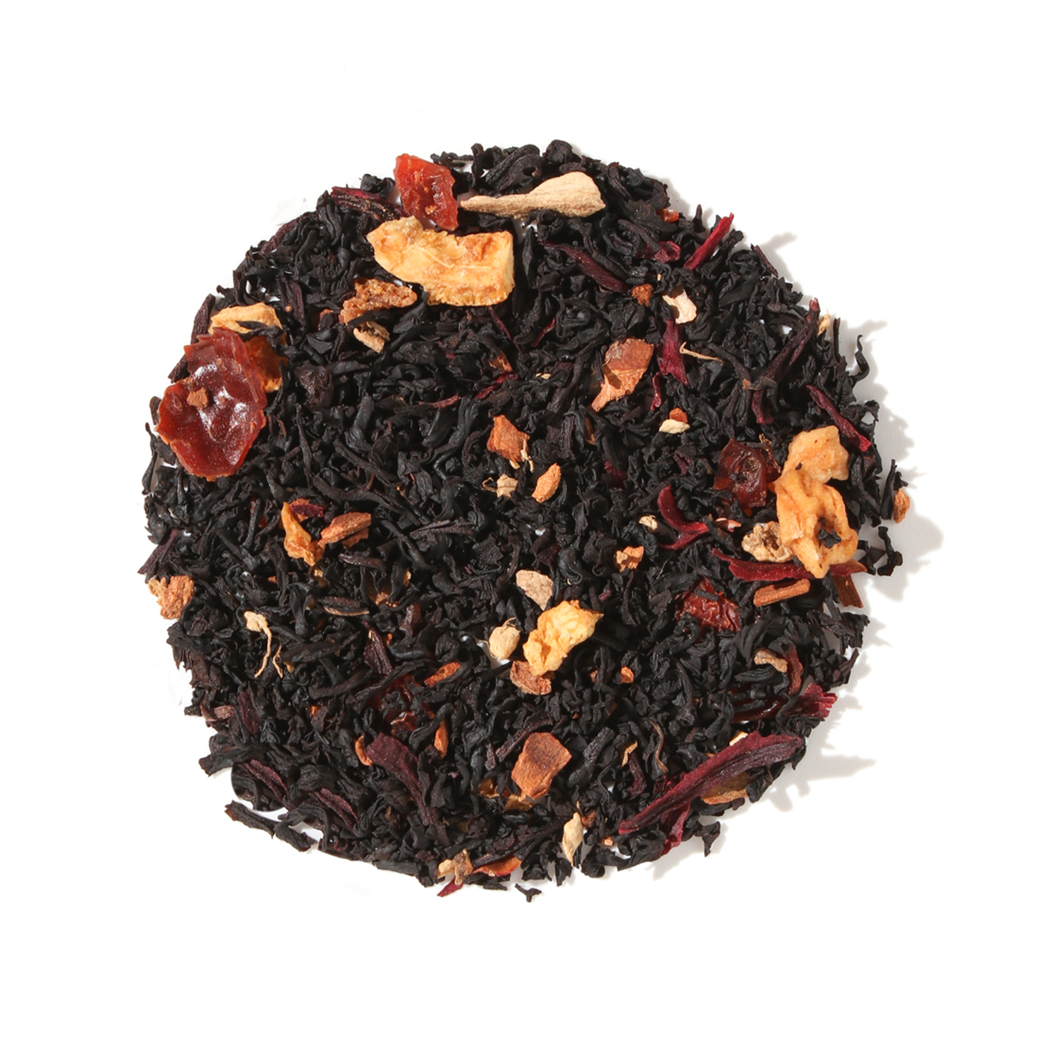 Plum Deluxe Vanilla Toddy Black Tea in a clear glass cup, showcasing its rich dark color and vanilla aroma.