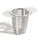 Victorian mesh cone tea infuser labeled "Nest" by Plum Deluxe Tea, with intricate mesh design for steeping loose leaf tea.