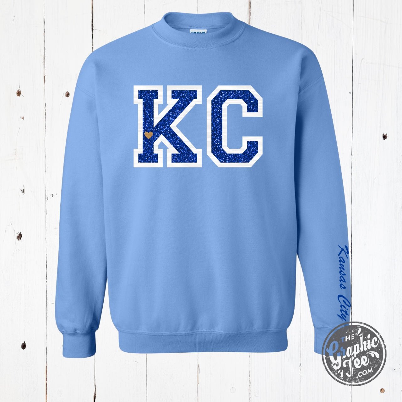 Powder blue KC glitter applique crewneck sweatshirt by The Graphic Tee, featuring a stylish glitter design on soft fabric.