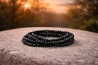 4mm faceted black tourmaline crystal energy bracelet featuring natural black tourmaline stones, designed for protection and energy balance.
