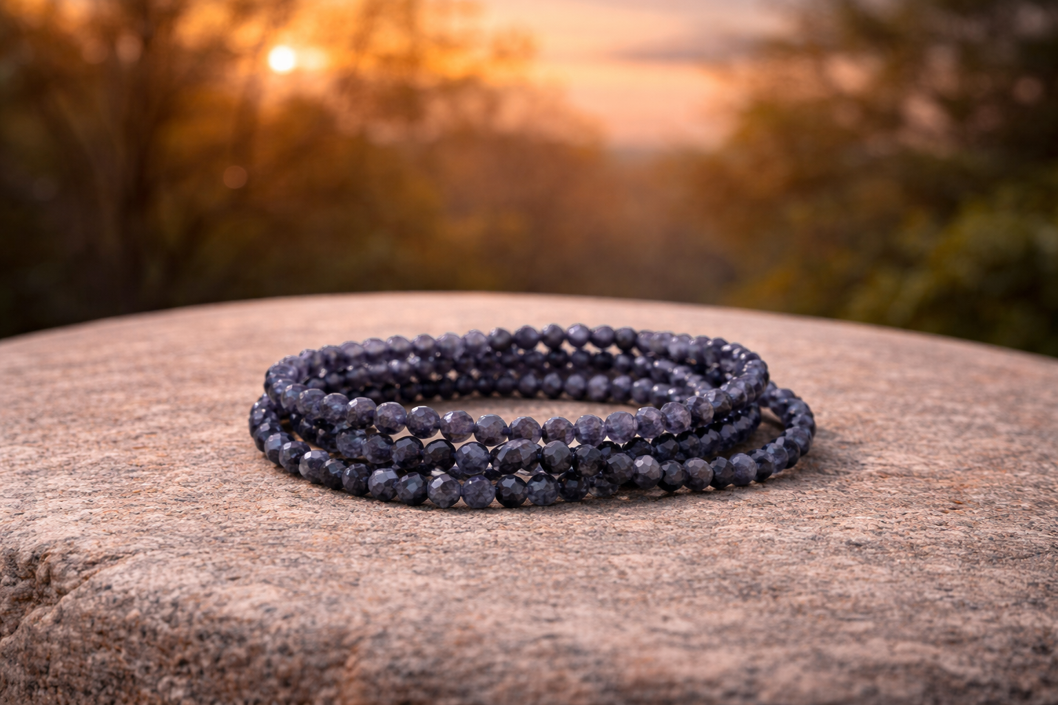 4mm faceted natural iolite cordierite crystal energy bracelet with polished stones, showcasing vibrant blue and purple hues.