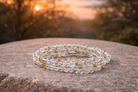 4mm natural golden topaz crystal stone energy bracelet featuring golden-yellow gemstones on a stretch cord.