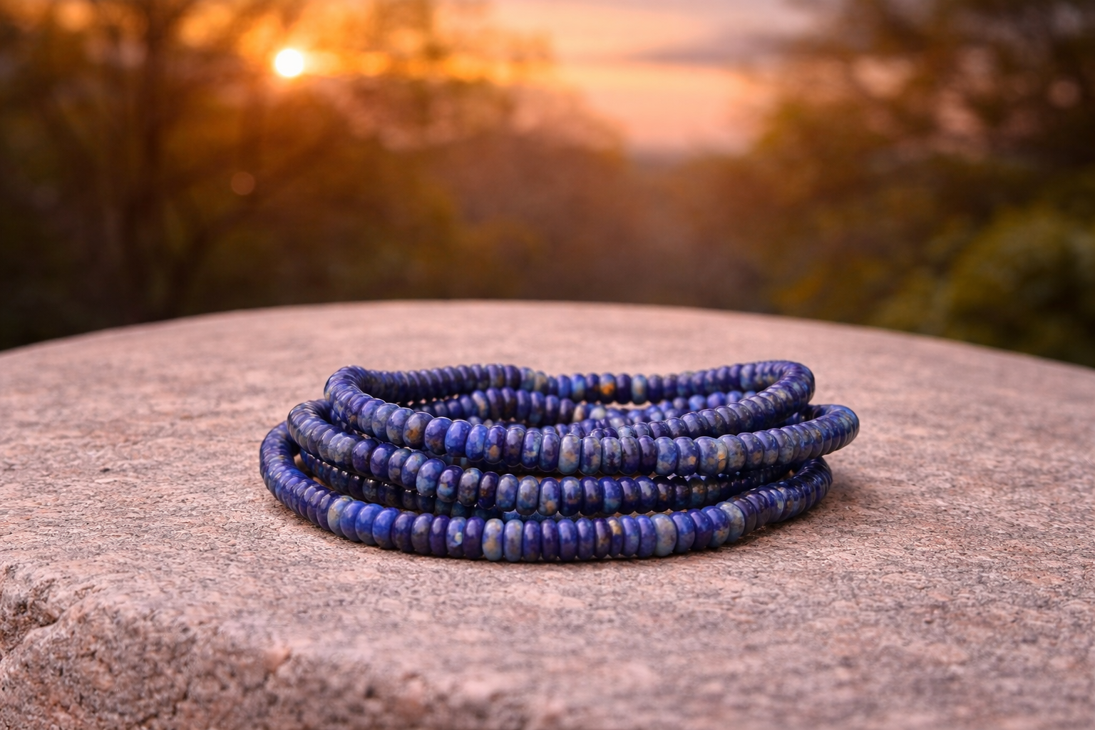 4mm natural lapis lazuli crystal stone energy bracelet showing deep blue gemstones with gold-toned accents.