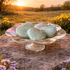 Caribbean Calcite hearts from Practical Magic Store showing smooth, polished stones with vibrant blue and green hues.