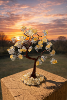Citrine gemstone prosperity money tree with green wire branches and natural stones, symbolizing abundance and good luck.