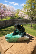 Emerald frog carving made of vibrant green stone, detailed with intricate carvings, from Practical Magic Store.