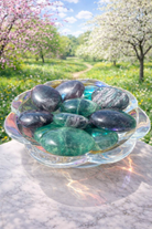 Green Feather Fluorite crystal energy palm stone with vibrant green and purple hues, smooth polished surface, ideal for meditation.