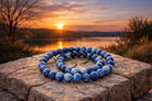 Faceted 8 mm Lapis Lazuli bracelet featuring deep blue stones with gold-toned accents, designed by Practical Magic Store.