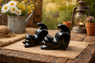 Black obsidian crystal stretching cats figurines, natural stone sculpture for meditation and decor, from Practical Magic Store.